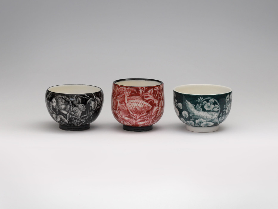 Three monochrome teacups