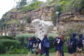 A group of students admire Michael Purdy's "Spinal Column".