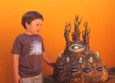 Mandu Barrios admiring a Jenny Orchard ceramic in the courtyard 2012.
