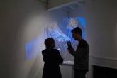 Linton Meagher in front of his work "Dove" - perspex, feathers, paint & LED lights - September 2011.